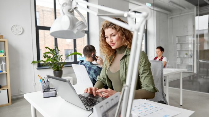 business, technology and people concept - creative woman with la